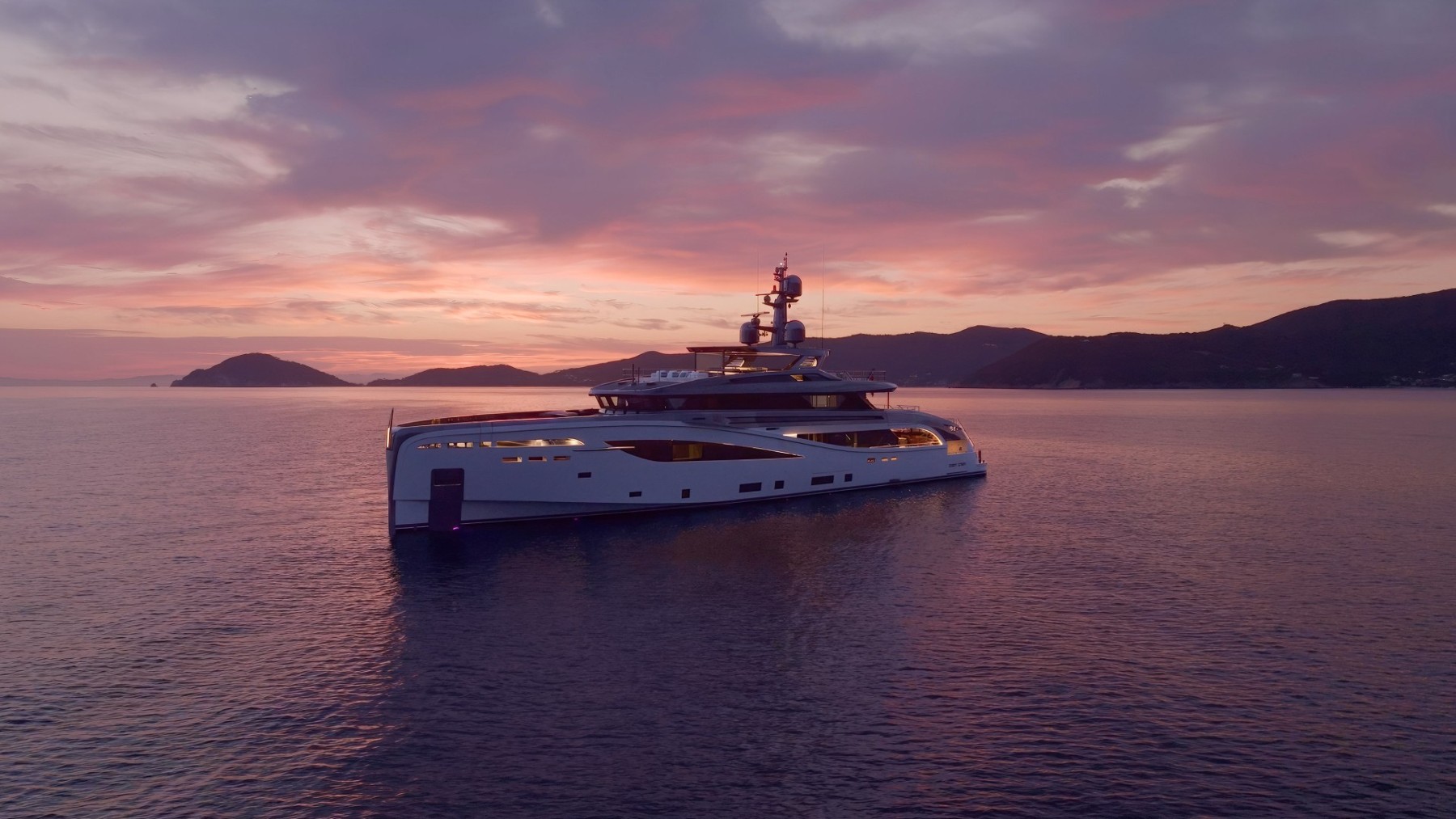 Superyacht at sunset — travel and unique experiences